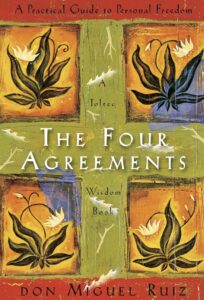 The Four Agreements book at Dame Salon Spa team book club